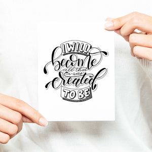 I will become all that I was created to be black and white hand lettered greeting card on a white folded card with A2 envelope shown with a woman in a white sweater holding card