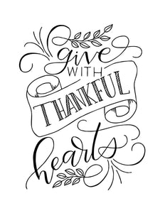 wall art design that says give with thankful hearts in hand lettering and calliagraphy with illustrated swirls, leaves and ribbon banner in black and white