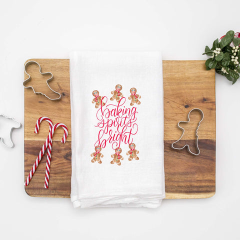 Floursack Kitchen Tea Towel with watercolor painted dancing gingerbread men that says baking spirits bright